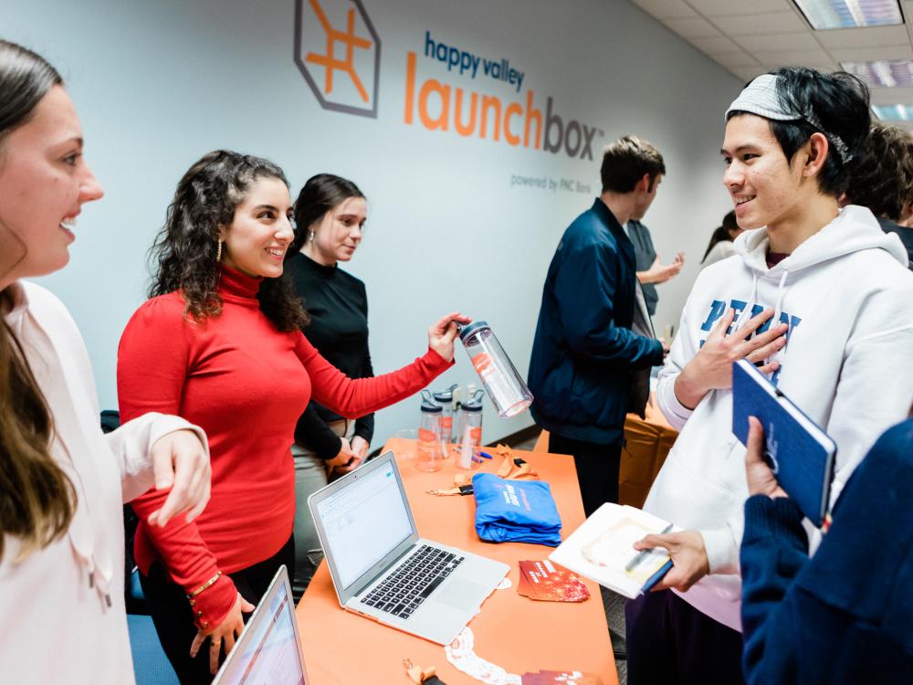 Students volunteers assist other students and community members at a GEW event at Happy Valley LaunchBox powered by PNC Bank