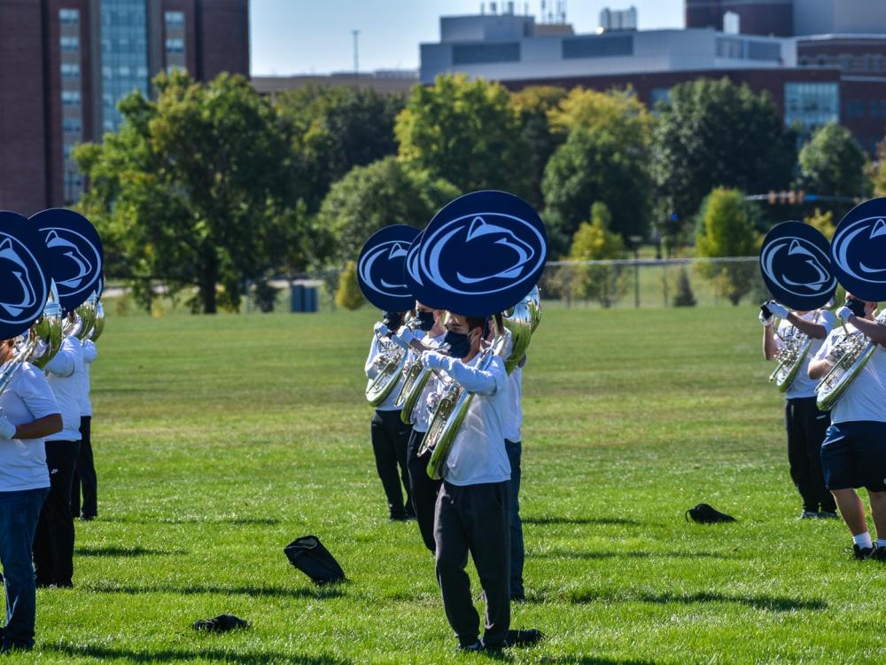 Blue Band tuba players wearing special masks that still allow them to play their instruments