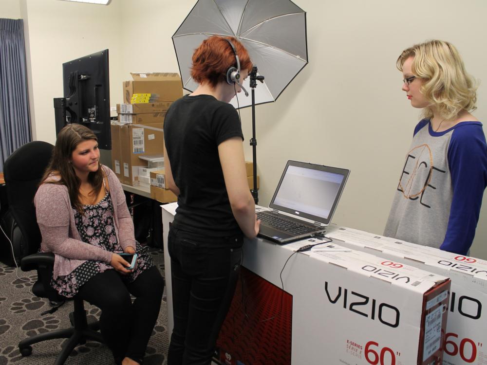 Amber Adams uses laptop to create accessible content for hearing impaired students