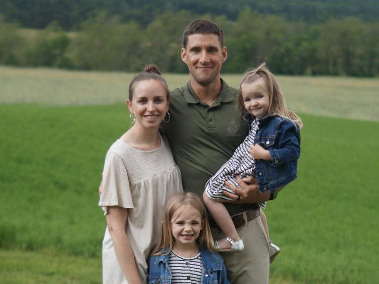 Benjamin Courter with his wife, Hillary, and their two children