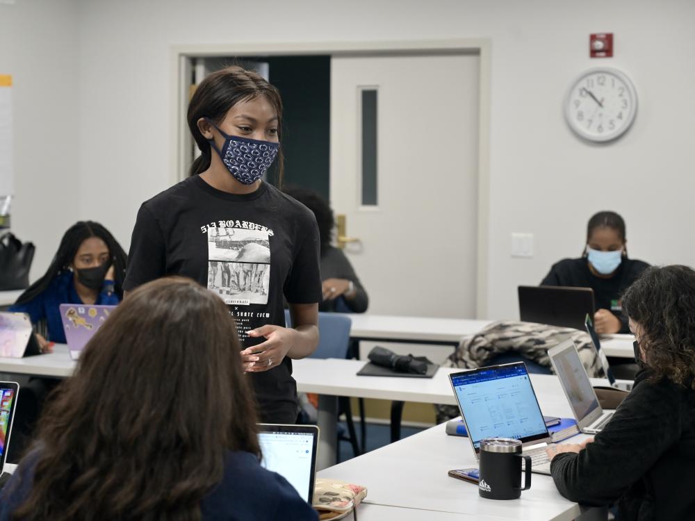 Janiyah Davis stands in front of a class of students