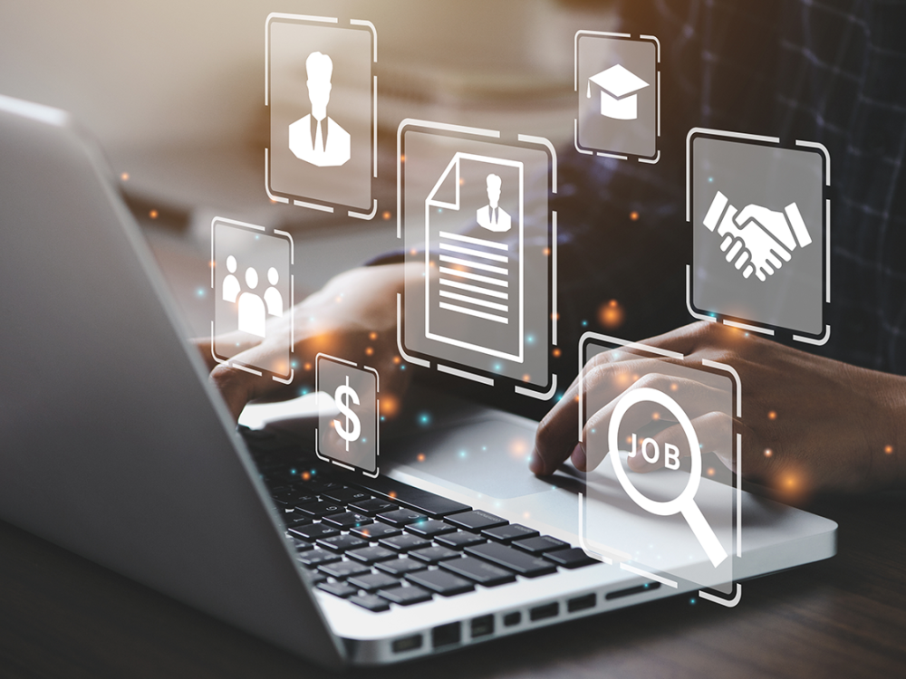 Graphics representing money, a graduation cap, hands shaking and papers overlay an image of hands using a laptop 