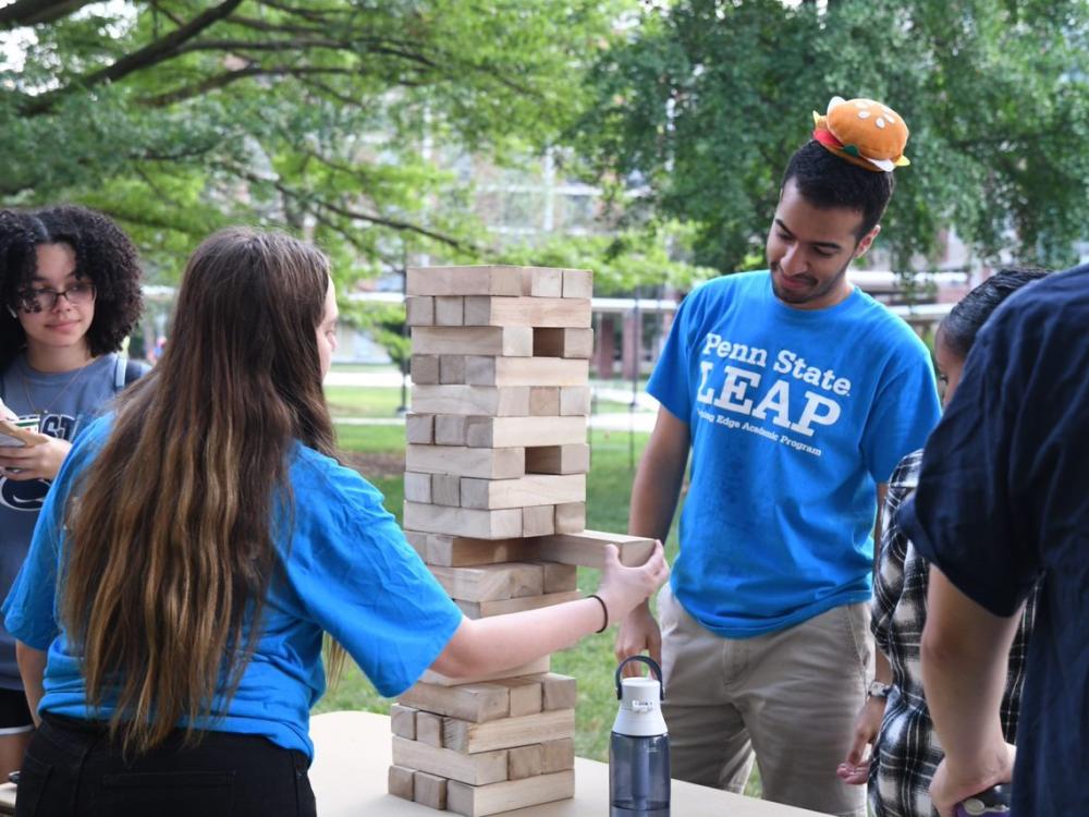 Students playing Jenga game at LEAP