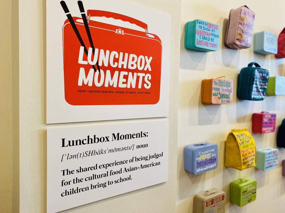 Lunchbox Moments display of lunchboxes with stories painted on them