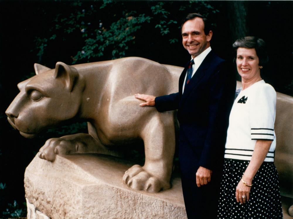 Marly Thomas, former first lady of Penn State, stands with her husband Joab, former Penn State president, beside the Lion Shrine.