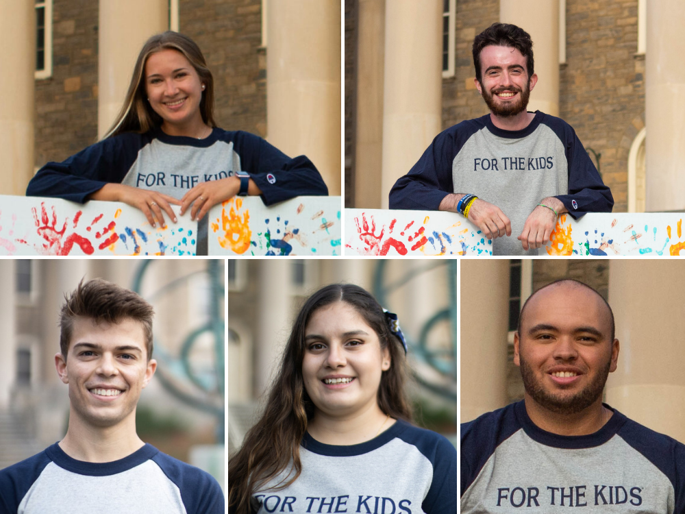 Five students smiling in front of Old Main