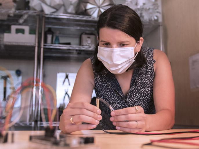 Elena Vazquez working at a desk in the Stuckeman Center for Design Computing