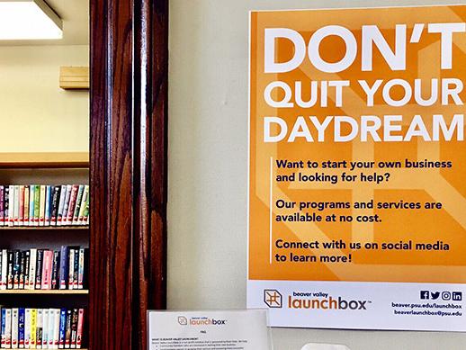 A photo of a LaunchBox poster that says Don't Quit Your Daydream