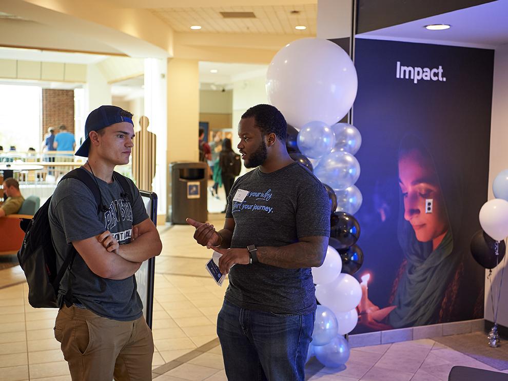 Two students talking at the Engagement Space