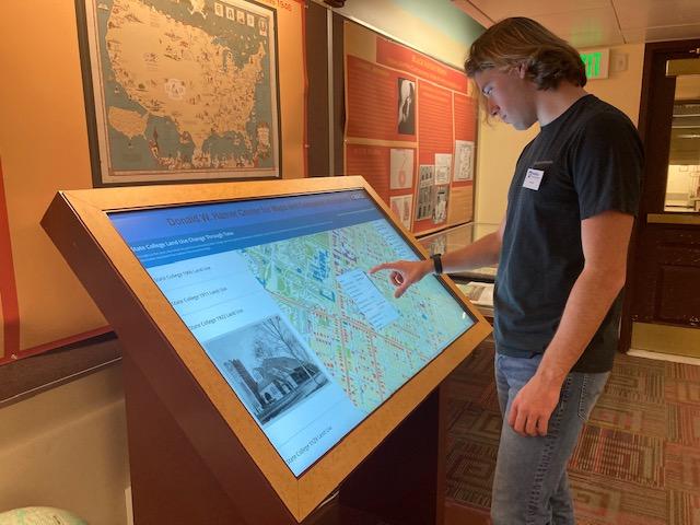 Student at digital map display