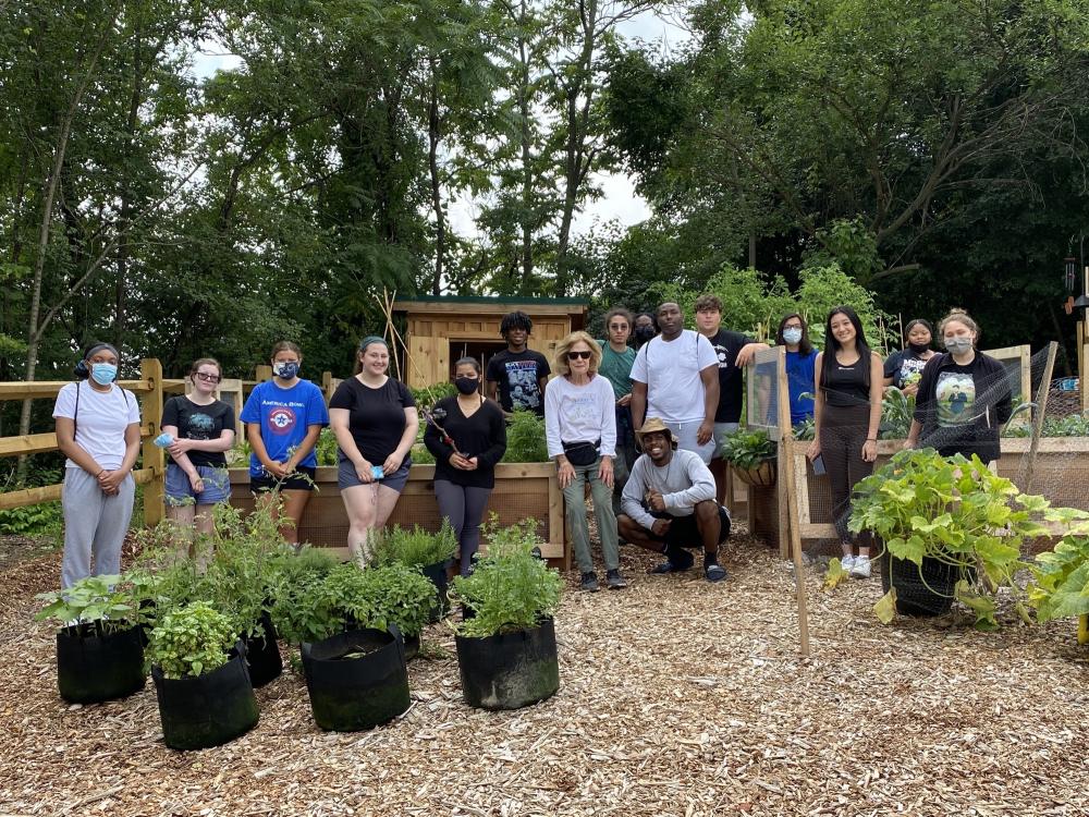 Students participating in the RI at Penn State Summer Program standing in a garden.