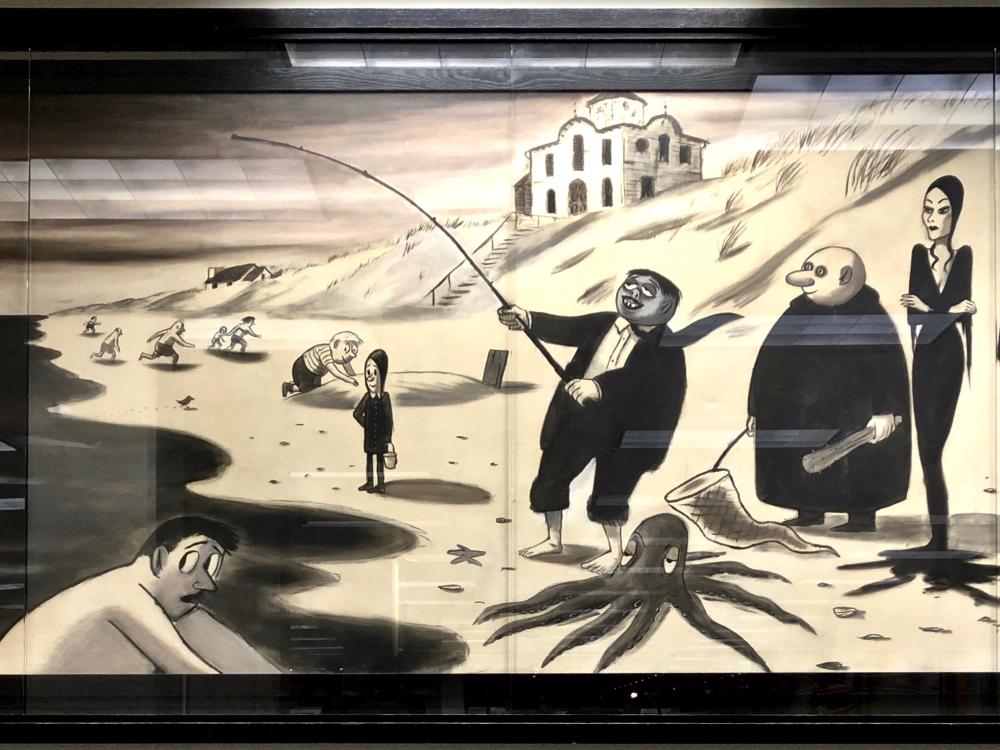 photo of wide mural of black and white painted cartoon character family