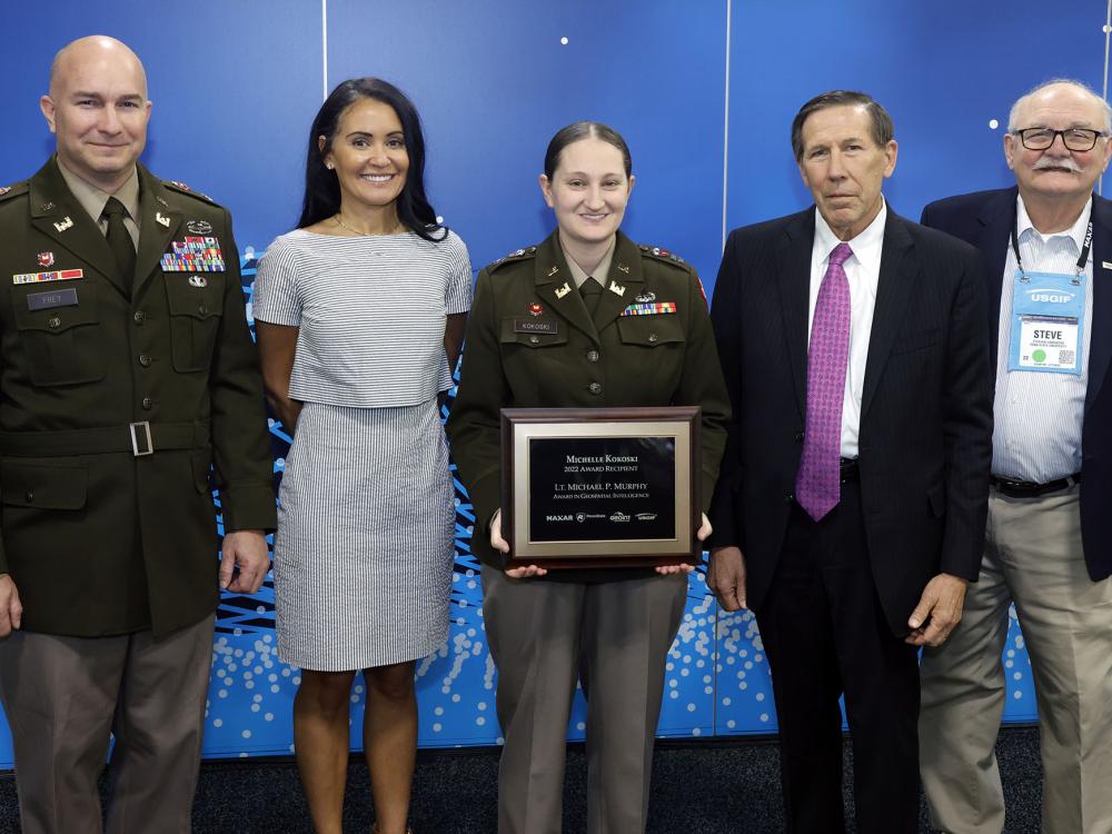 Michelle Kokoski receives the Murphy Award with faculty