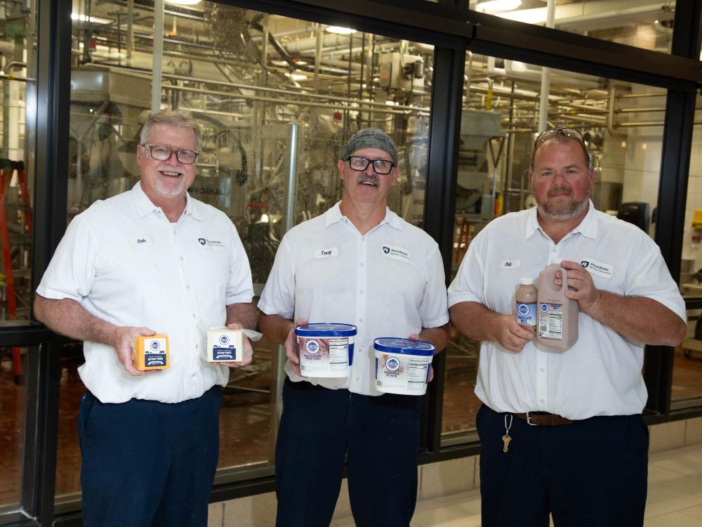 Terry Grove, Bill Kurtz, and Bob Rosenberry holding up this year's and last's winning products.