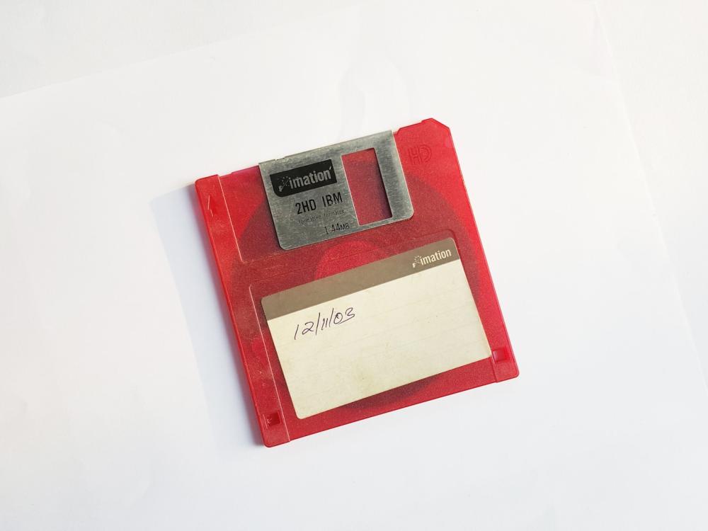 photo of 1.4 megabyte floppy disk with written date 12/11/03