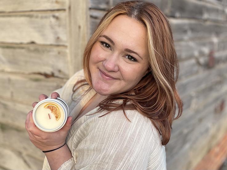 Kelsey Lauer portrait holding a candle