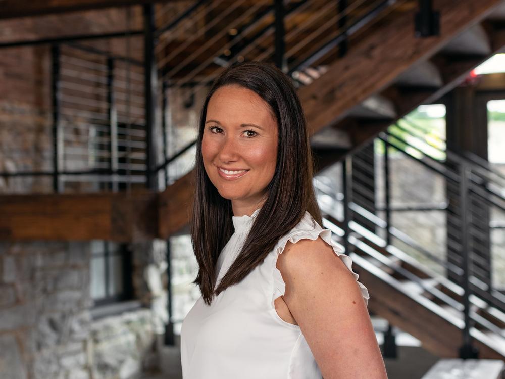 Aliana Steinbugl wearing white with stairs in the background