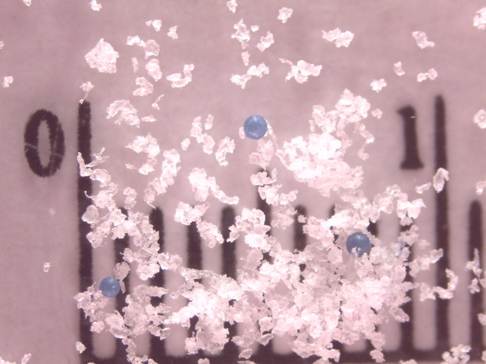 Plastic microbeads suspended in water