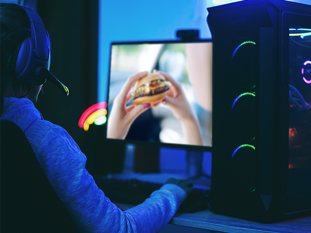 hamburger displayed on the monitor of a computer in a dark room