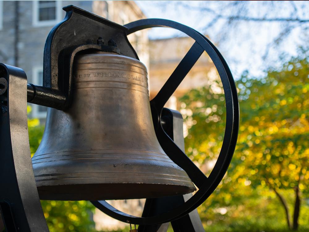 The original bronze bell that hung in Old Main, now on display beside Old Main.