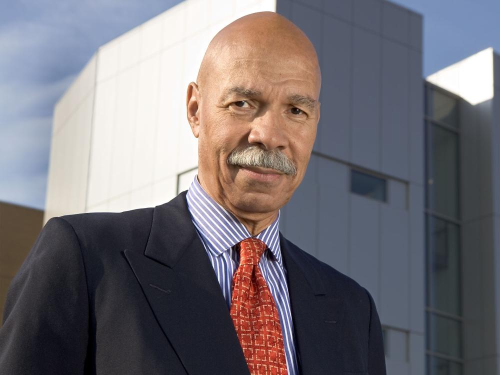 Randall Robinson wearing a suit and tie.