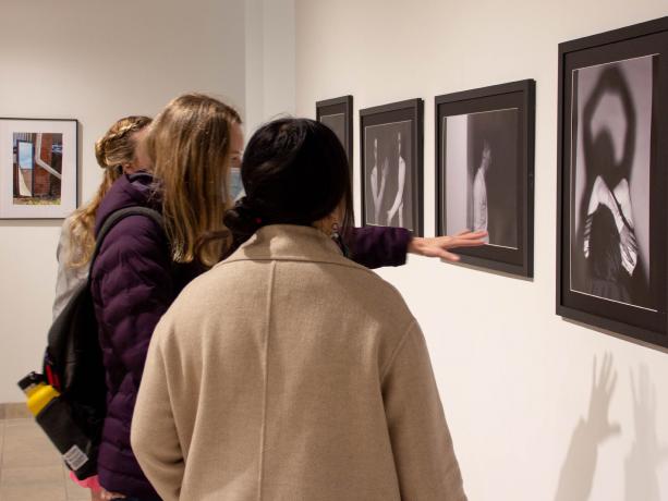 Visitors view works during the annual School of Visual Arts Graduate Research Exhibition in the HUB Galleries.