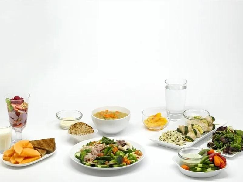 a variety of healthy foods on white plates