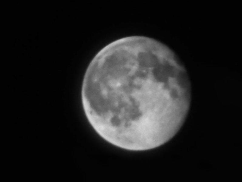 A black and white, close up photograph of the moon