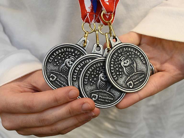 A close-up image of awards medals