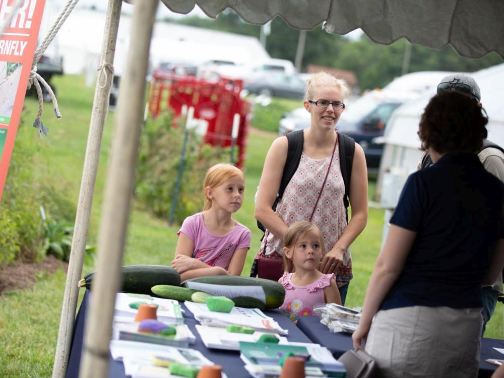 master gardener answers family's questions at Ag Progress Days