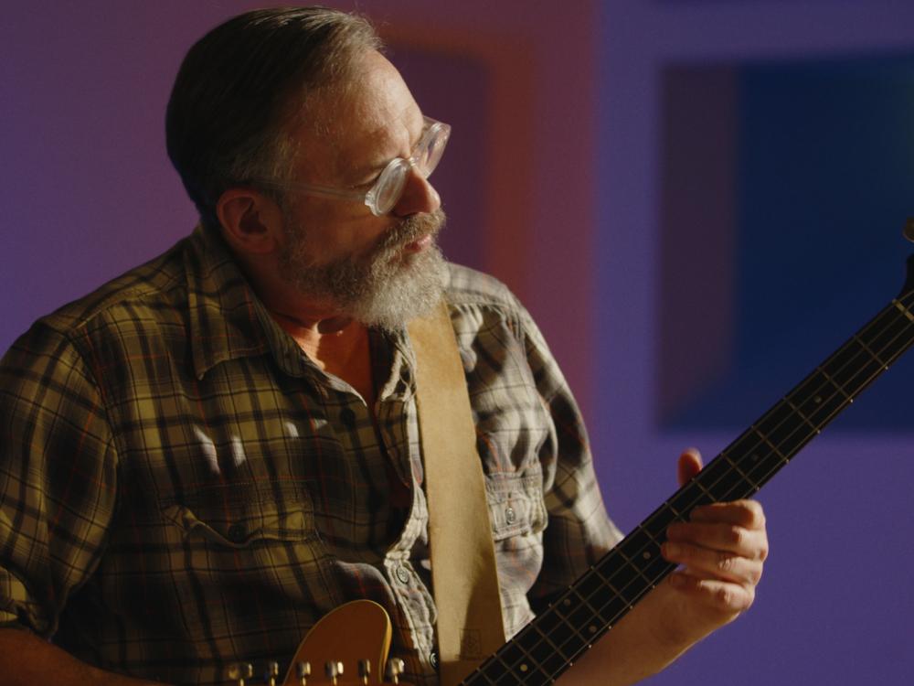 Craig Newschaffer plays the guitar