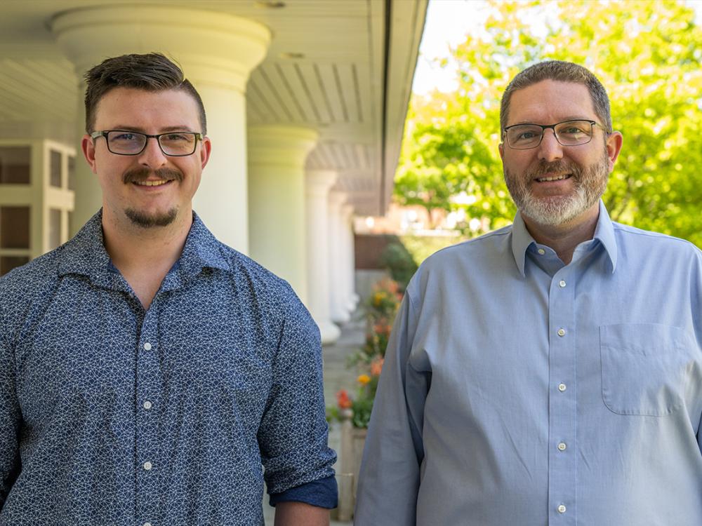 An outdoor portrait of two individuals. 