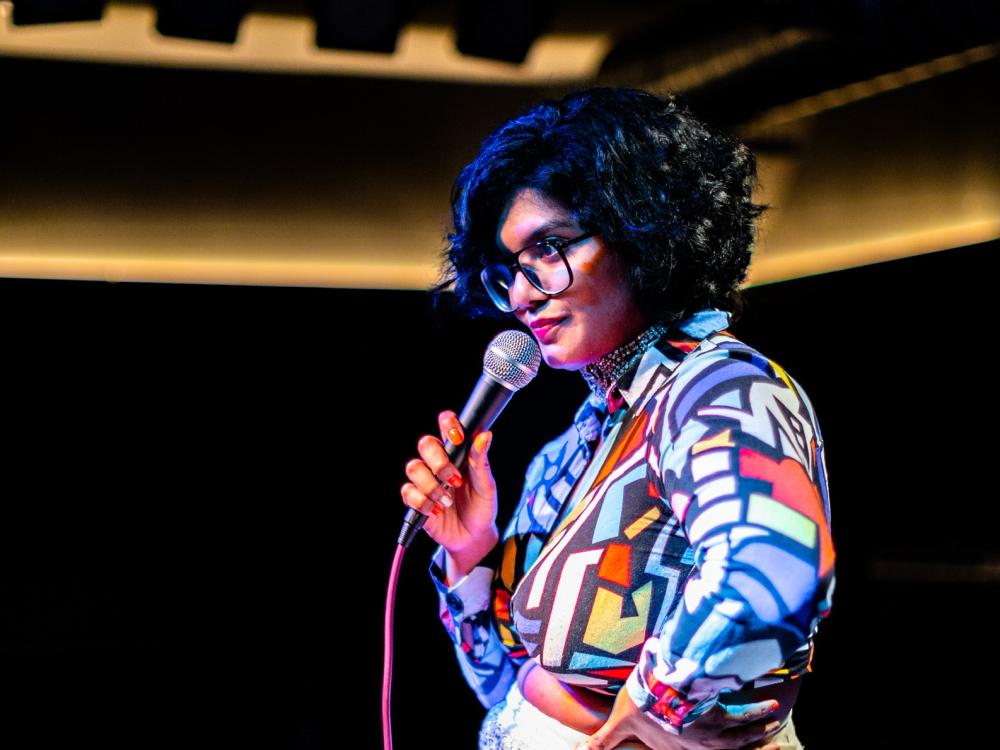 A woman performing standup comedy