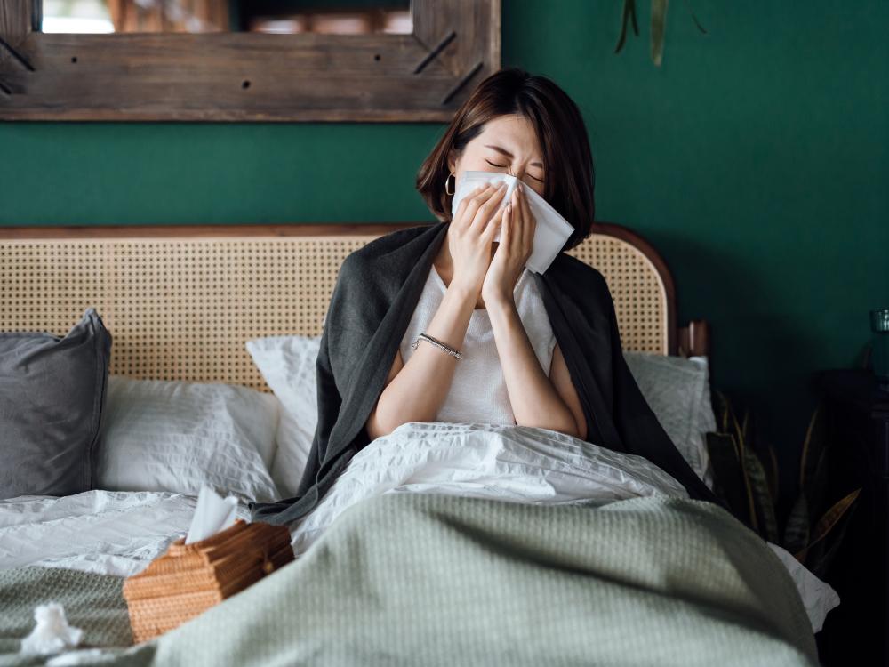 Woman sick in bed