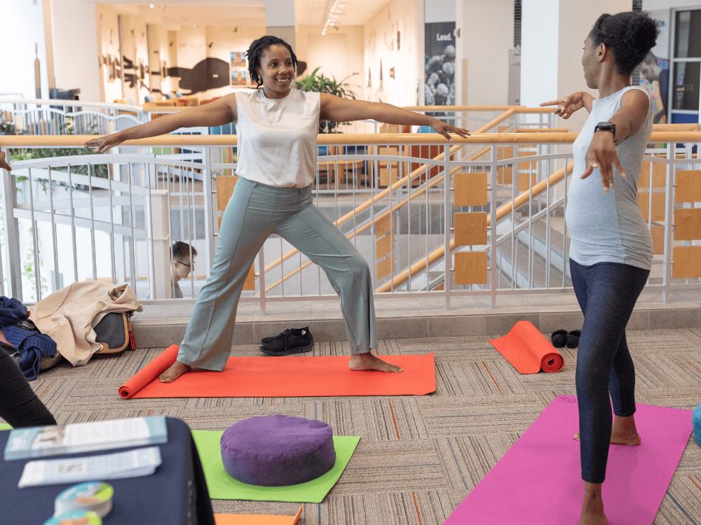 Two young ladies doing yoga poses.