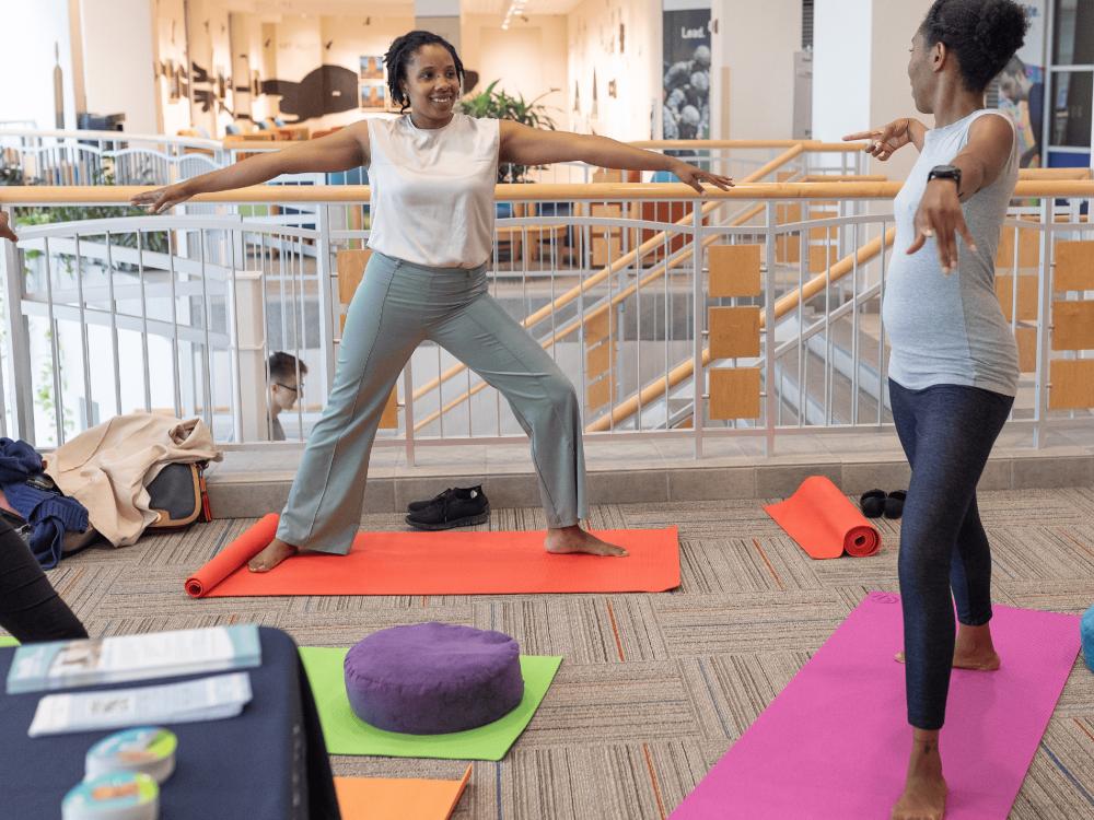 Two young ladies doing yoga poses.