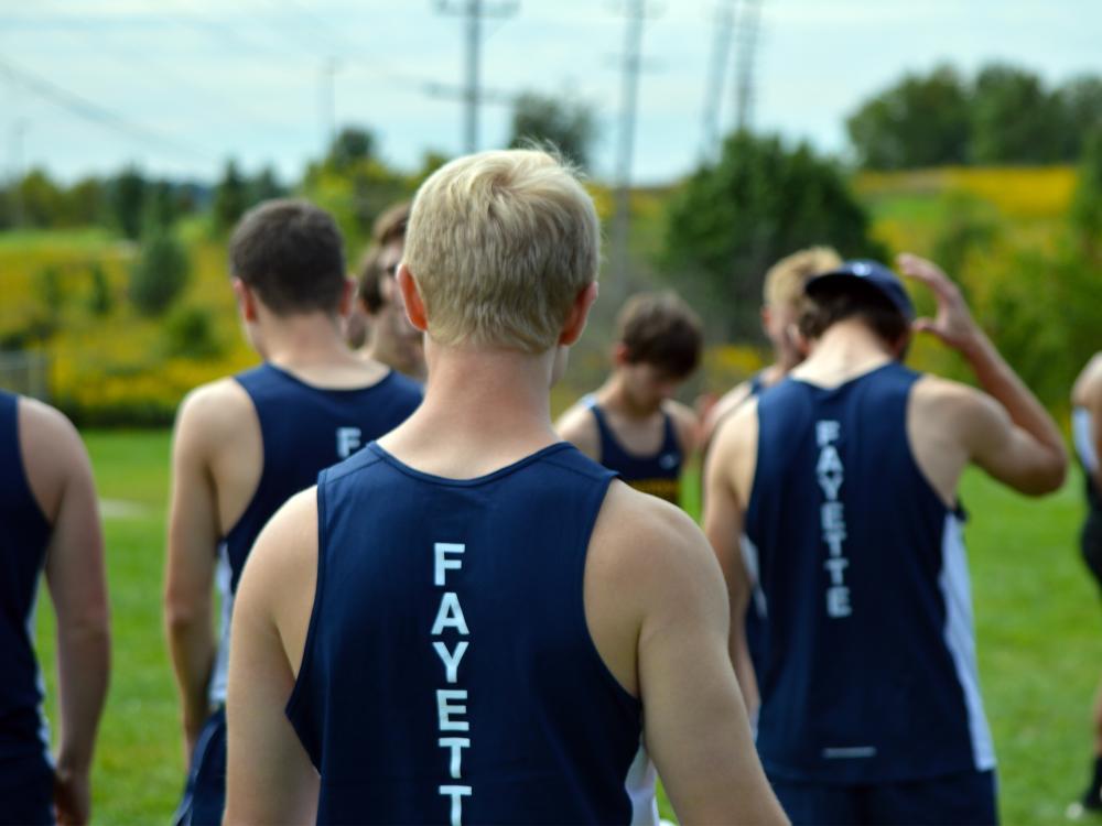 Cross-country athletes on the field.