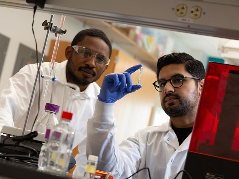 Two grad students in lab