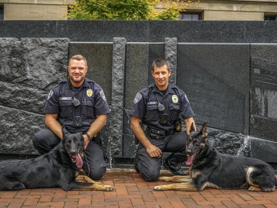 Penn State University Police Officers Josh Quimby and Dustin Miller with K9 Officers Bo and Zain at University Park.