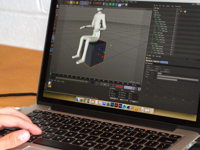 hand on a laptop with the screen showing creation of a digital human image