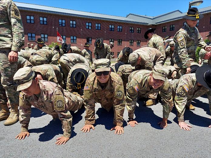 A group of Amr soldiers does push ups. 