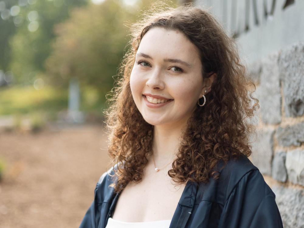 Smiling girl with dark shoulder-length hair