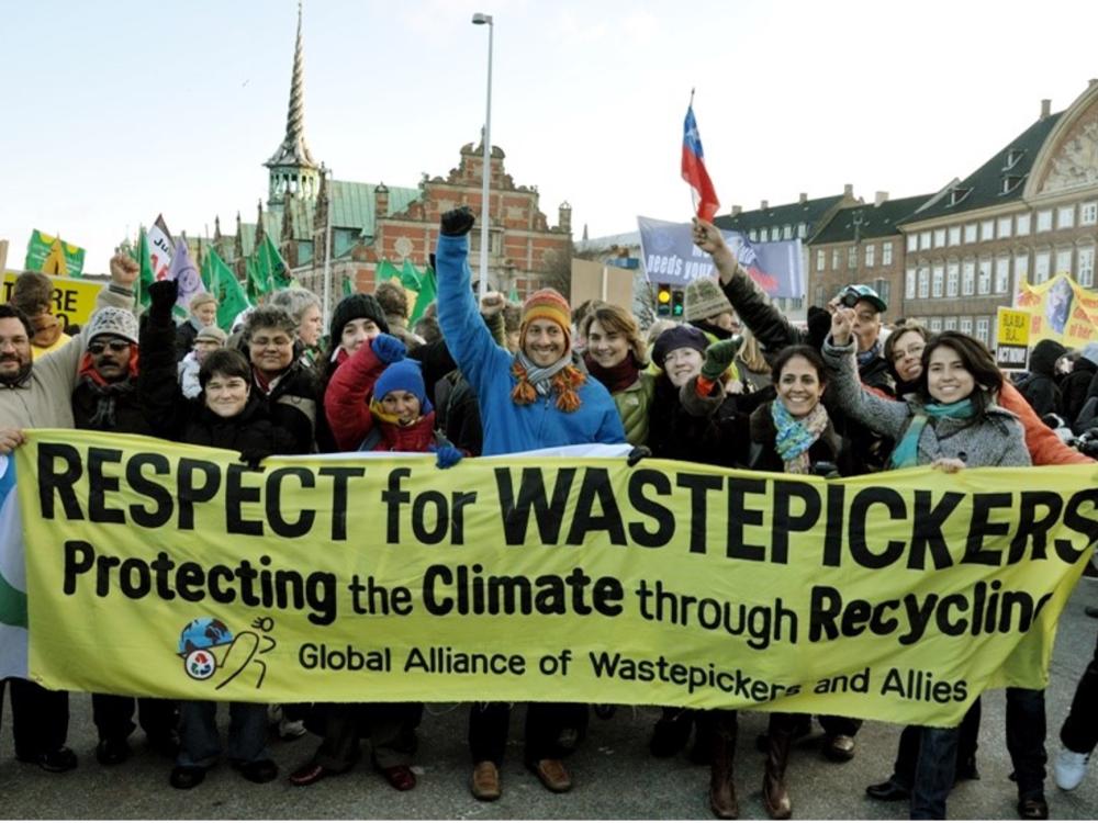 A protest by waste pickers at a conference in Copenhagen, Denmark, highlights the movement by waste workers globally to organize for rights that will be discussed at a January 31st talk.