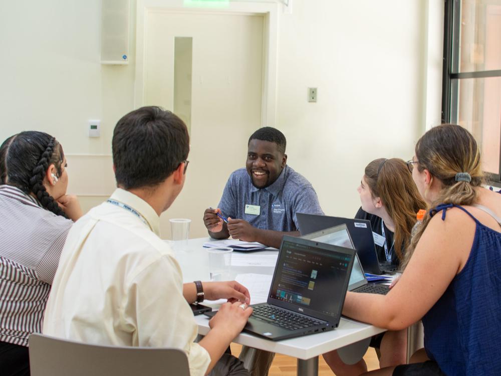 Four people sitting around a table