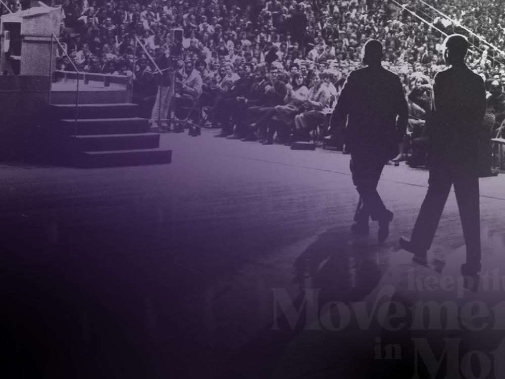 Martin Luther King Jr. walks across the Rec Hall stage at Penn State