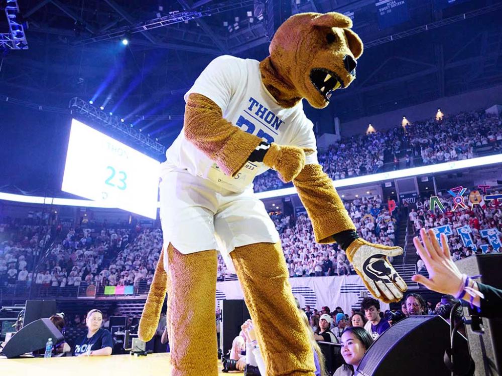 Nittany Lion mascot standing on stage