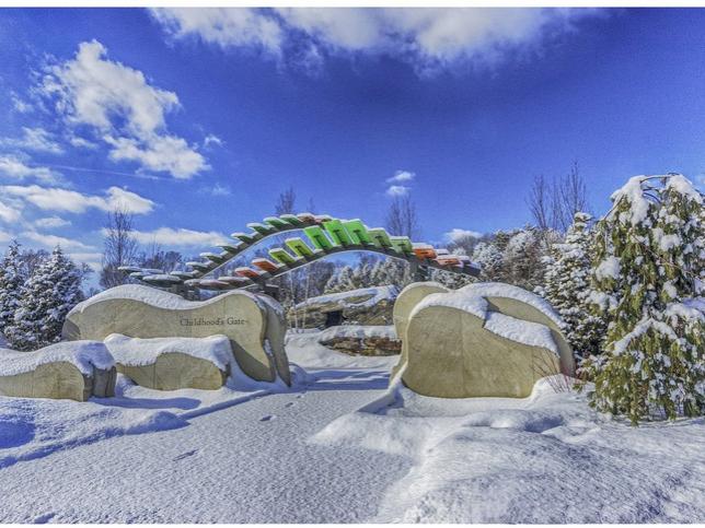A photo of the entryway to a children's garden in the snow