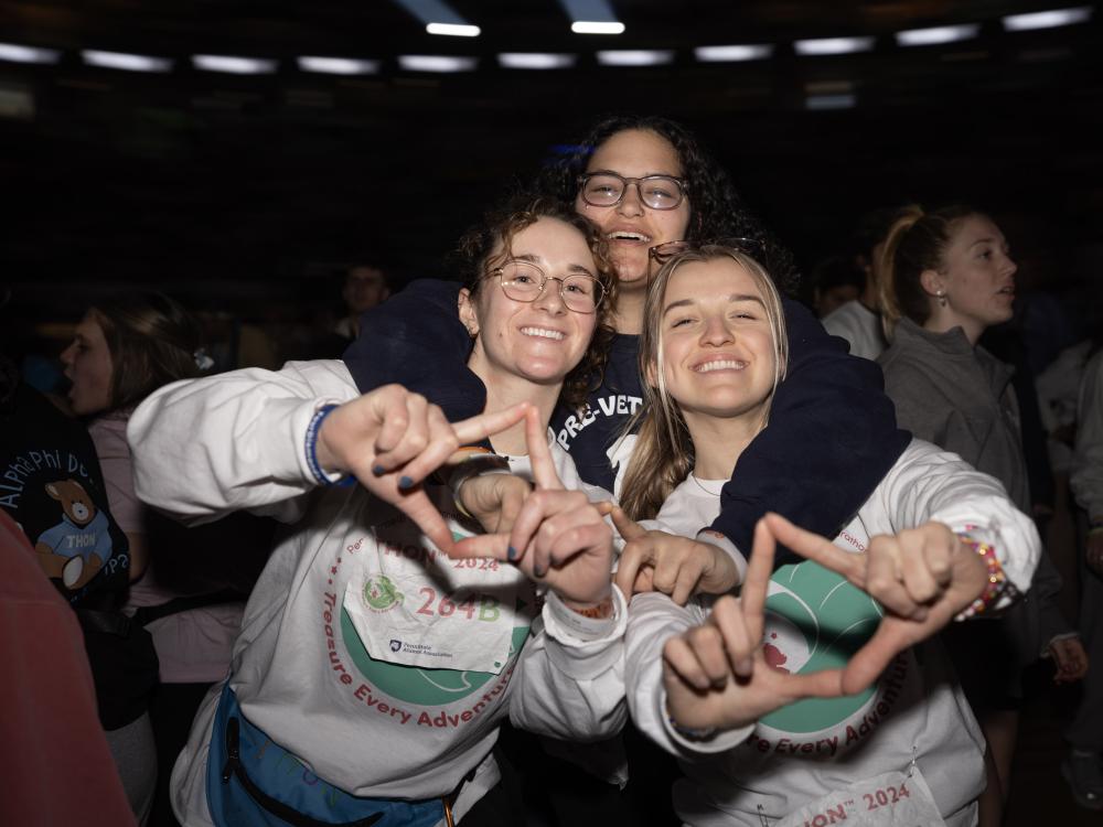 Dancers show the four diamonds sign