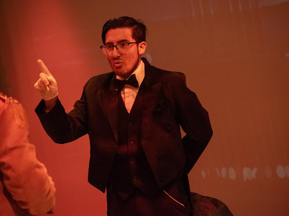 In the Penn State Harrisburg production of "Clue," a student portraying Mr. Boddy points a finger in the air