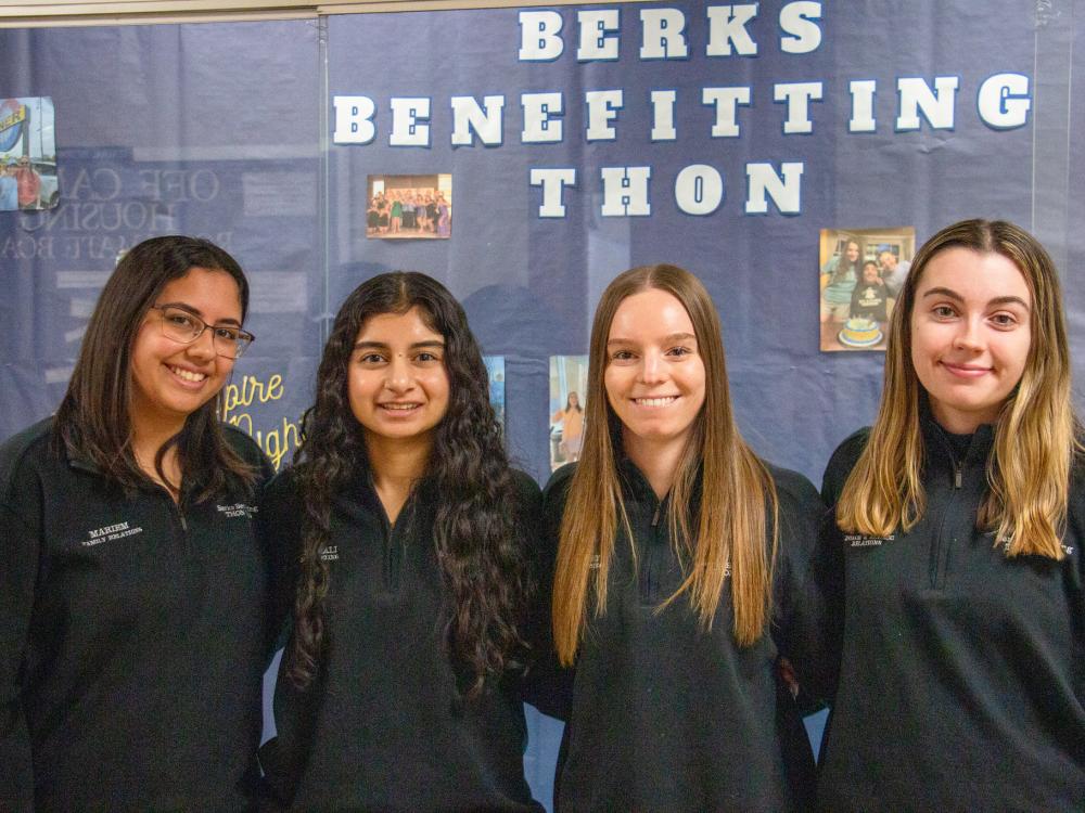 Four female Berks students smile for the camera